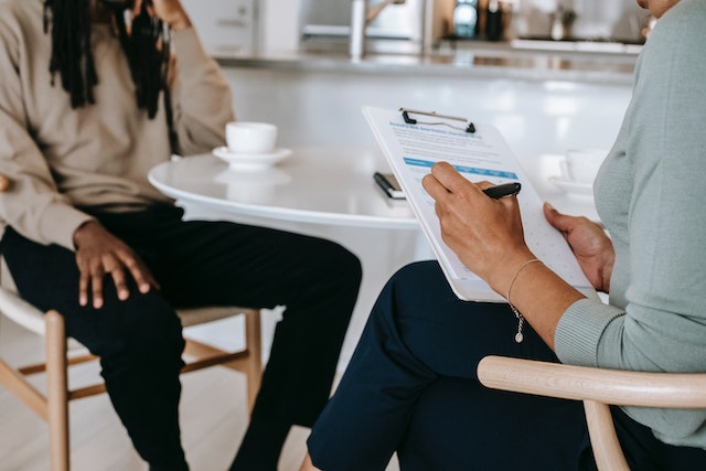 two people sitting at table for interview